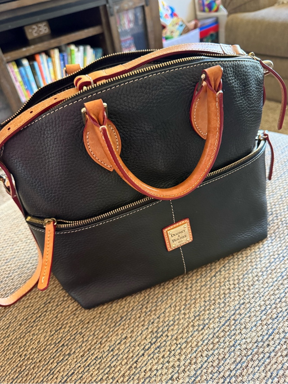 Dooney & Bourke Black Satchel with Tan Trim, matching cosmetic bag and key fob.